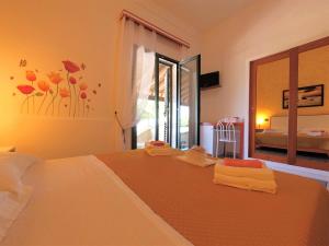 Postel nebo postele na pokoji v ubytování Hotel Alba Chiara Sant'Andrea Salento