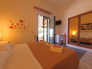 Postel nebo postele na pokoji v ubytování Hotel Alba Chiara Sant'Andrea Salento