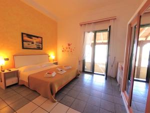 Postel nebo postele na pokoji v ubytování Hotel Alba Chiara Sant'Andrea Salento