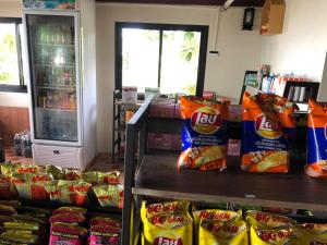 a store filled with lots of bags of potato chips at Koh Mook Sivalai Beach Resort in Ko Mook