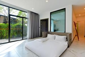 Ένα ή περισσότερα κρεβάτια σε δωμάτιο στο Grand Sappaya Hotel +138 φωτογραφίες