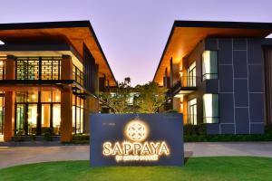 a building with a sign in front of it at Sappaya Hotel By Lotus Valley Golf Resort in Chachoengsao