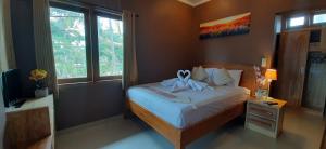 The point surfcamp Bali客房内的一张或多张床位