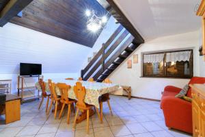 a dining room with a table and chairs at Appartamento MARMOLADA - CANAZEI in Canazei