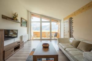 A seating area at Praga Apartments & Restaurant Zell am See-Kaprun