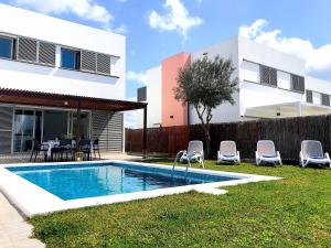 a house with a swimming pool in the yard at Villa d’Aina * Propiedad privada con piscina in Cala'n Bosch