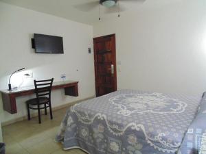 Postel nebo postele na pokoji v ubytování Hotel Hacienda