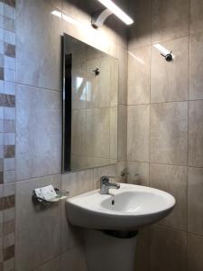 a bathroom with a sink and a mirror at hotel Yanis in Lozenets +101 photos