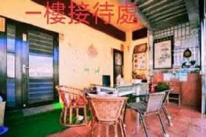 a dining room with chairs and a table at FuLu home stay in Chulu