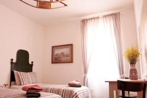 Ein Bett oder Betten in einem Zimmer der Unterkunft Ritornello B&B