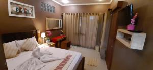 The point surfcamp Bali客房内的一张或多张床位