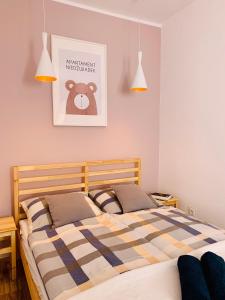 Posteľ alebo postele v izbe v ubytovaní Apartament Niedźwiadek