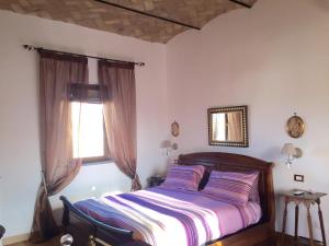A bed or beds in a room at SUPERATTICO SUL COLOSSEO