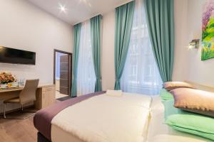Posteľ alebo postele v izbe v ubytovaní Global Suites Budapest