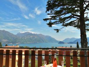 a table with a view of a lake and mountains at CO.RI. Appartamenti in Menaggio