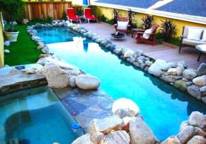 a swimming pool with a deck and a patio with chairs at Lg BEACH Home, POOL, Hot Tub, Close to Beaches & Downtown El Segundo Beach in El Segundo
