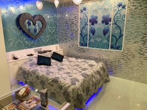 a room with a bed and a heart on the wall at Restay Tokorozawa (Adult Only) in Tokorozawa