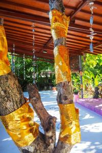 a tree that is wrapped in yellow plastic at Villa Dua in Nusa Dua
