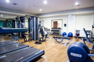 a gym with several treadmills and exercise machines at Holiday Inn Express Seguin, an IHG Hotel in Seguin