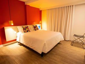 Rúm í herbergi á ibis Styles Campina Grande