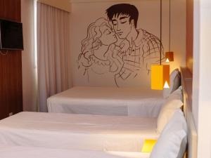 Ένα ή περισσότερα κρεβάτια σε δωμάτιο στο ibis Styles Campina Grande