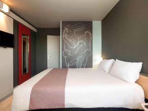 Postel nebo postele na pokoji v ubytování Ibis Alès Centre Ville