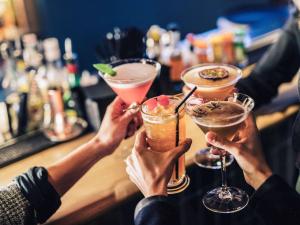a group of people holding up their drinks at Mercure Toulouse Centre Saint-Georges in Toulouse
