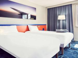 Кровать или кровати в номере ibis Styles Marseille Aéroport