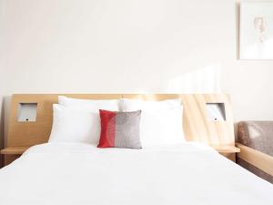 Cama ou camas em um quarto em Novotel Montpellier