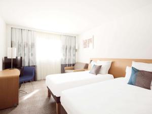 Katil atau katil-katil dalam bilik di Novotel Montpellier