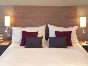 Postel nebo postele na pokoji v ubytování Mercure Hotel Frankfurt Eschborn Ost