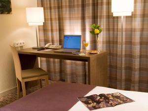 Postel nebo postele na pokoji v ubytování Mercure Hotel Frankfurt Eschborn Ost