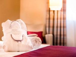 Postel nebo postele na pokoji v ubytování Mercure Hotel Frankfurt Eschborn Ost
