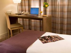 Postel nebo postele na pokoji v ubytování Mercure Hotel Frankfurt Eschborn Ost