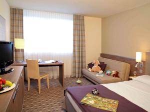 Postel nebo postele na pokoji v ubytování Mercure Hotel Frankfurt Eschborn Ost