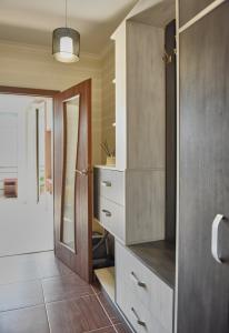 a bathroom with a dresser and a door with a mirror at ONE BEDROOM APARTMENT in IF city :) in Ivano-Frankivsʼk +14 photos