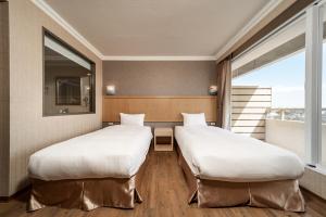 Krevet ili kreveti u jedinici u objektu Fish Hotel-Pingtung