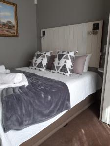Ένα ή περισσότερα κρεβάτια σε δωμάτιο στο Fochville Guesthouse