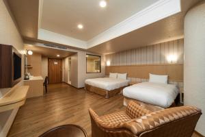 Krevet ili kreveti u jedinici u objektu Fish Hotel-Pingtung
