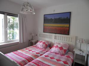 Postel nebo postele na pokoji v ubytování bb-oostkapelle vakantiewoning Iris
