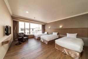 Krevet ili kreveti u jedinici u objektu Fish Hotel-Pingtung