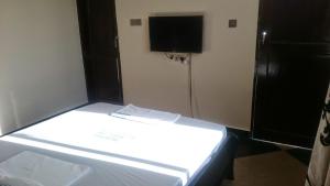 Ένα ή περισσότερα κρεβάτια σε δωμάτιο στο Itetemia Royal Inn +13 φωτογραφίες