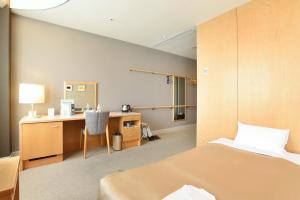 Postelja oz. postelje v sobi nastanitve Hotel Grand Vert Gizan