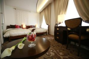 Postelja oz. postelje v sobi nastanitve Hotel Grand Vert Gizan