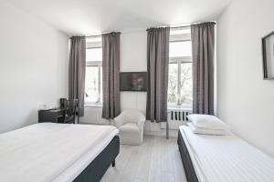 Postel nebo postele na pokoji v ubytování Hotel Bema