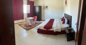 A bed or beds in a room at اوركيدا طريف Orchida Turaif 2 2