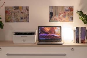 a laptop computer sitting on top of a desk at Il Garovaglio in Como