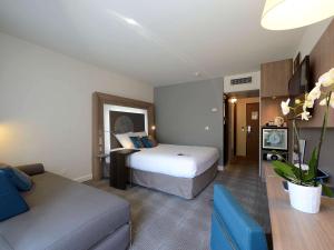 Postel nebo postele na pokoji v ubytování Novotel Avignon Nord