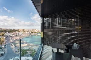a view of the ocean from a building at H Hotel & SPA - Adults Only in St. Julianʼs