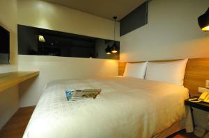 Letto o letti in una camera di Forward Suites II